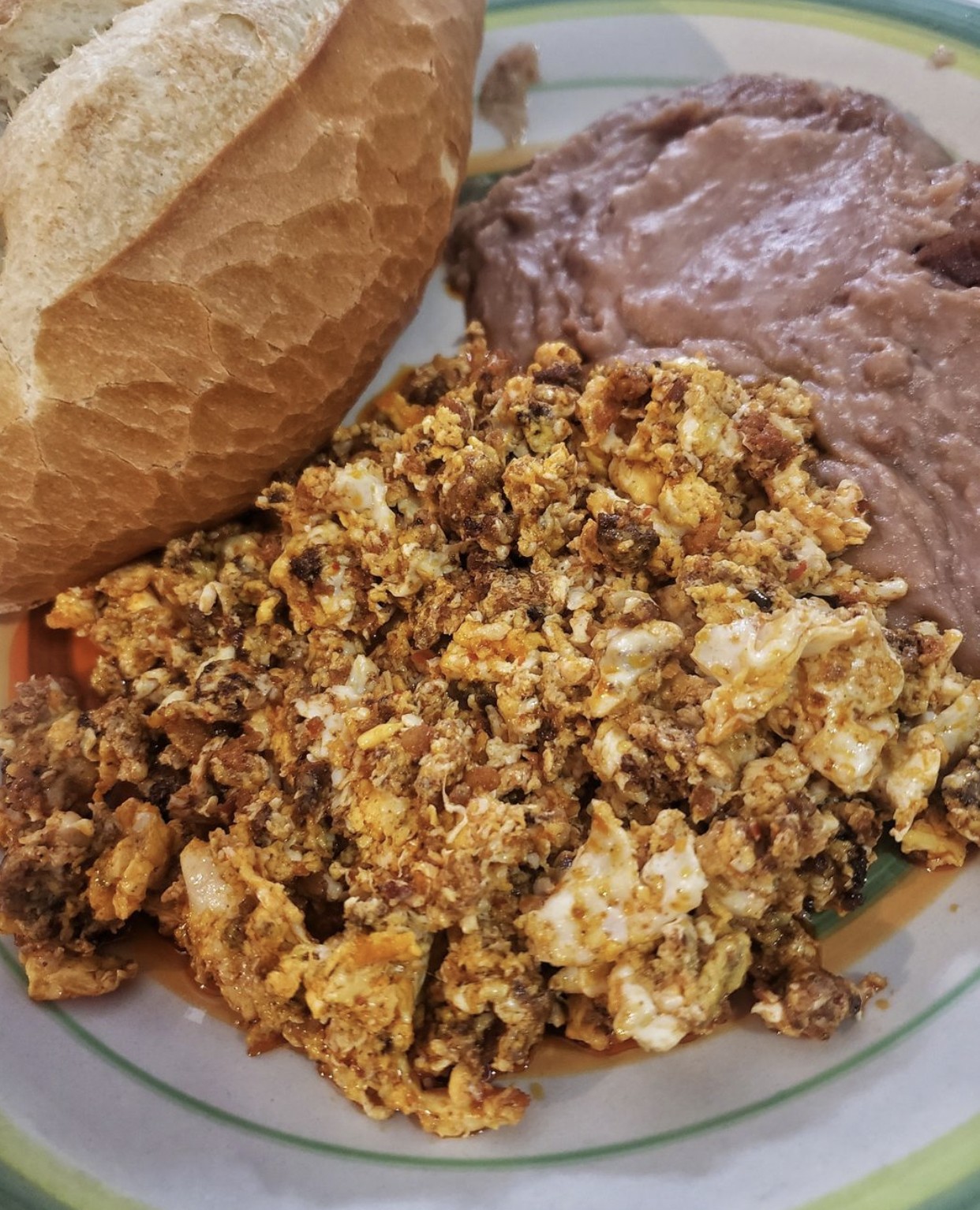 Mexican Eggs with Chorizo and Refried Beans Breakfast